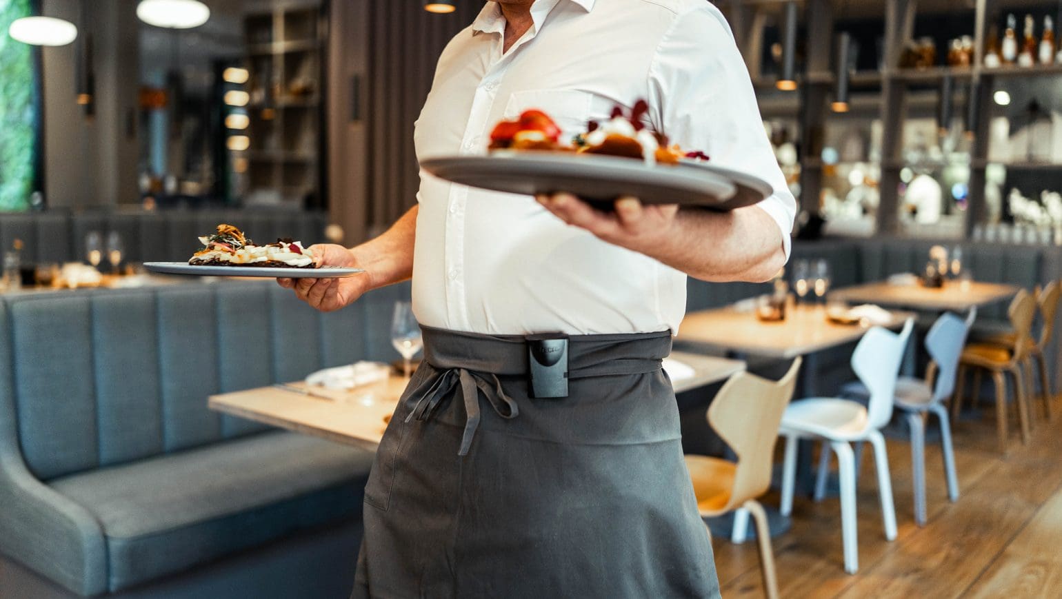picture of a waiter serving food