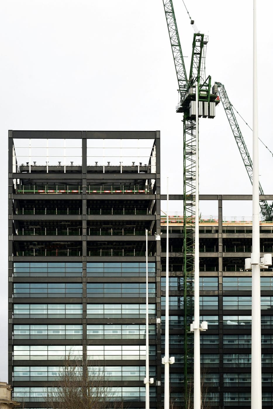 picture of a crane next to a half-finished building