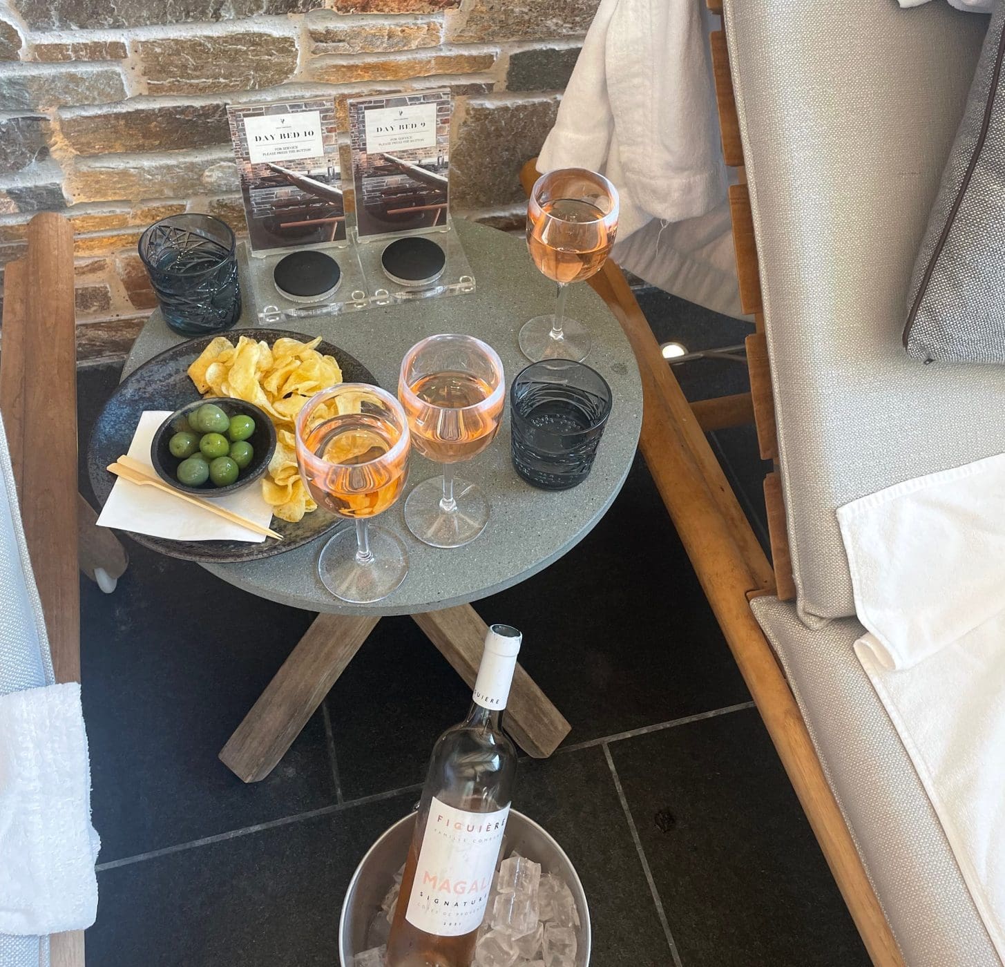 image of service delivered with wine, olives and snacks with pager system at a wellness center