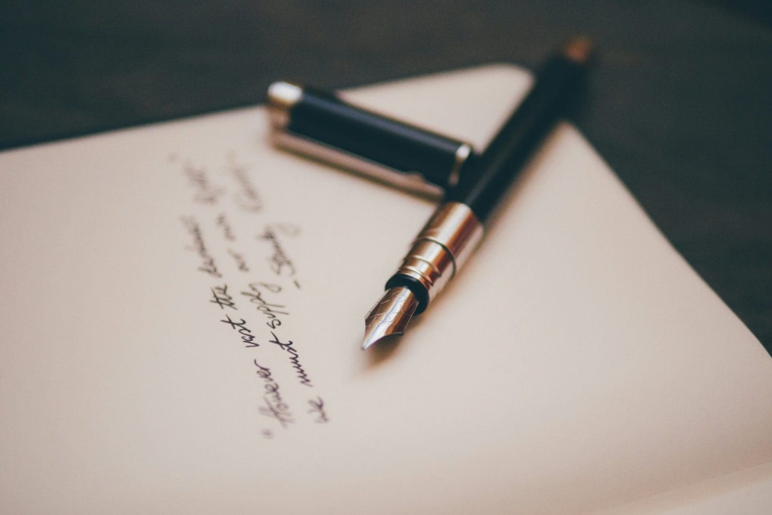 picture of a fountain pen next to some text