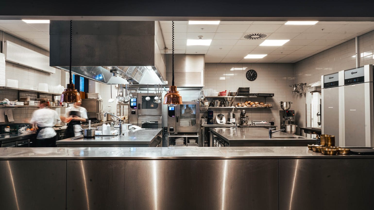 picture of a kitchen with two chefs