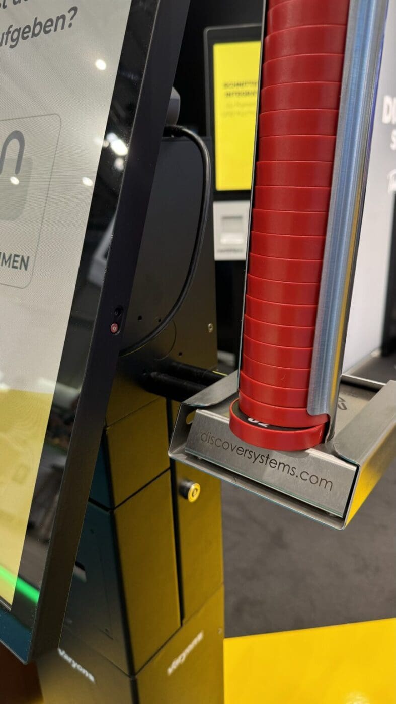 Self service kiosk with pager holder installed for queue notifications