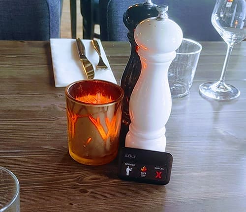 Call button placed on a restaurant table at Blackstone Steakhouse