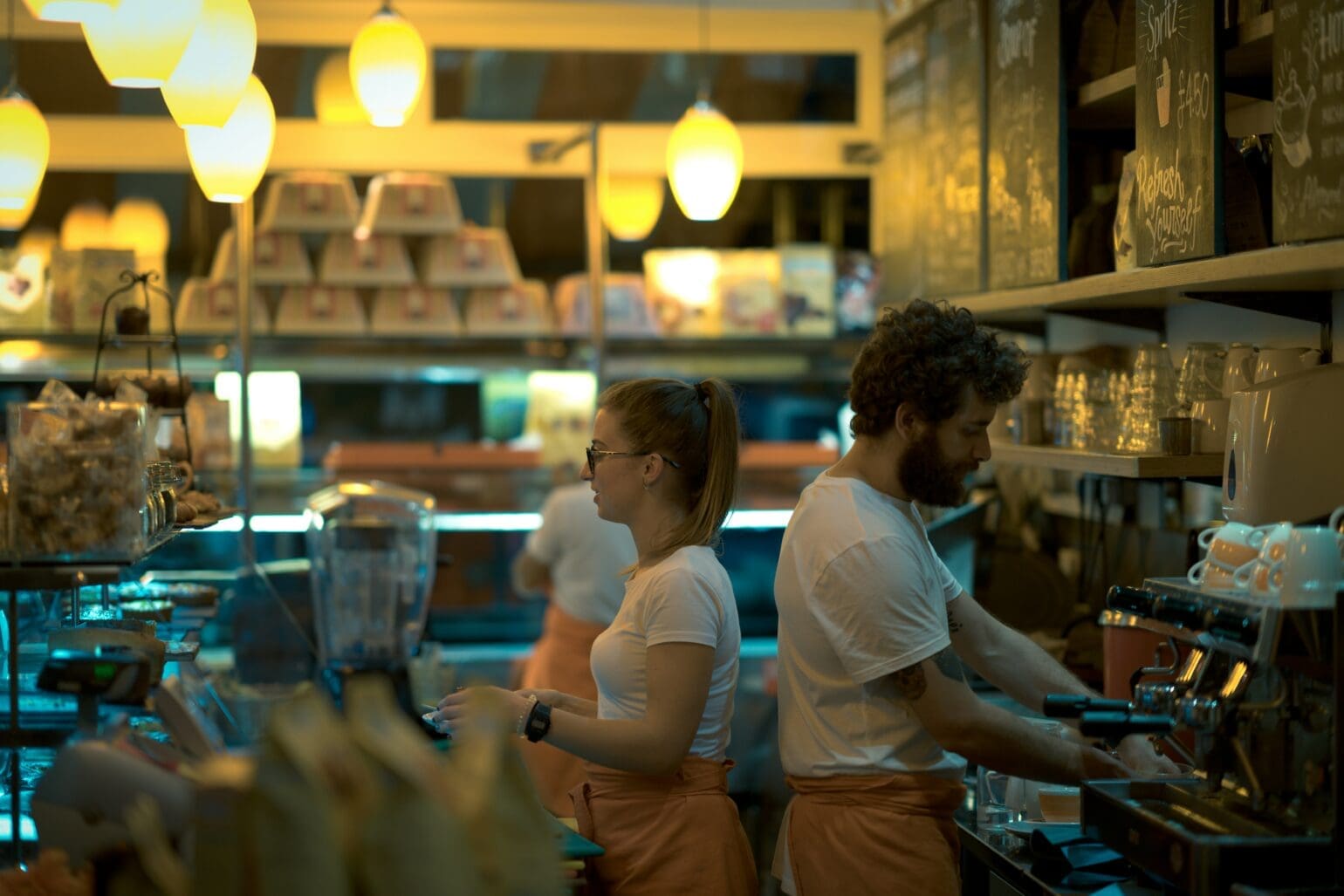 bakery employee serving customer at counter